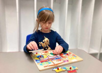 Girl putting a puzzle together
