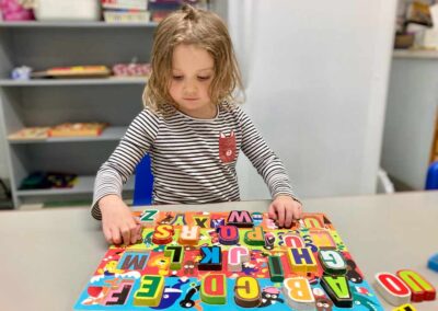 girl playing with a puzzle