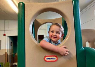 Boy playing on a play stucture